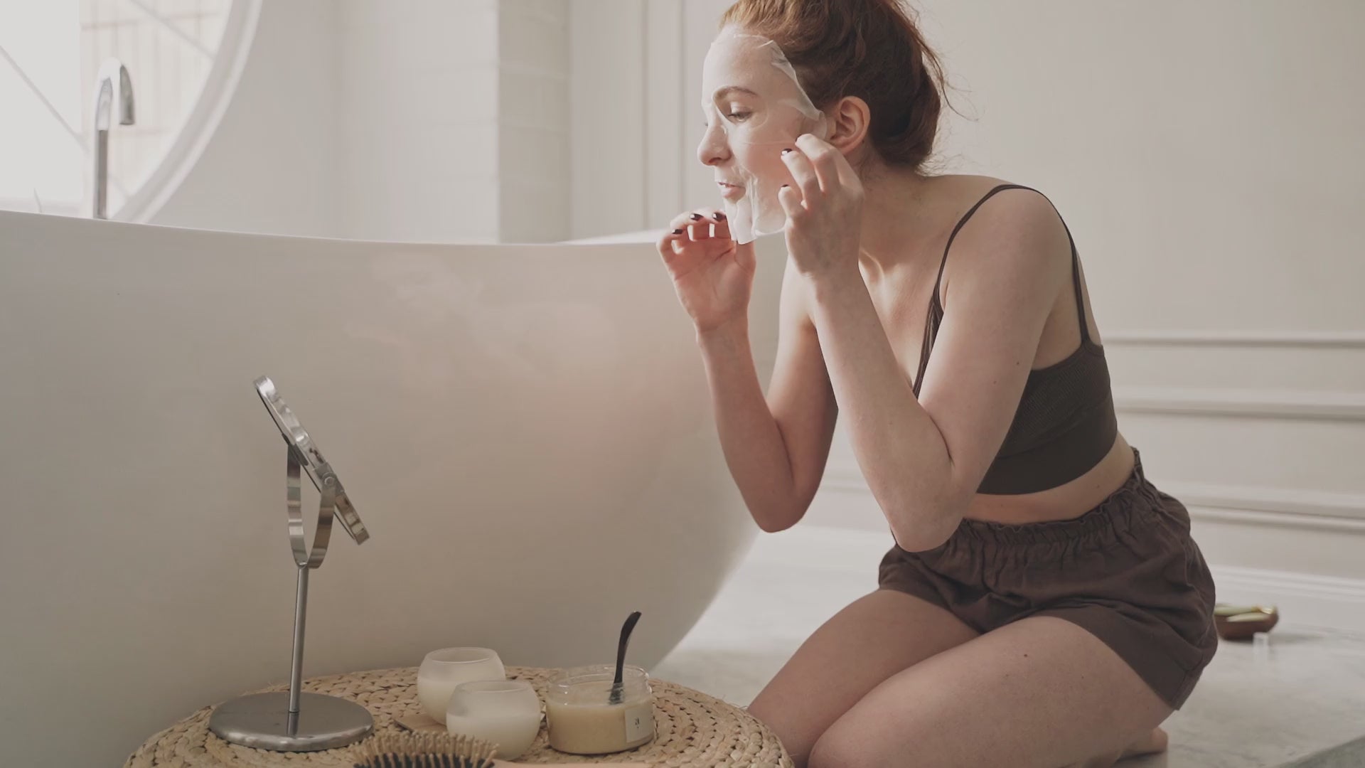 Load video: Close-up shot of a woman removing the Donk Donkey Face Mask, revealing radiant, refreshed skin. She appears happy and confident, showcasing the natural glow and soothing benefits of our paraben-free, non-comedogenic skincare. Perfect for promoting healthy, glowing skin.